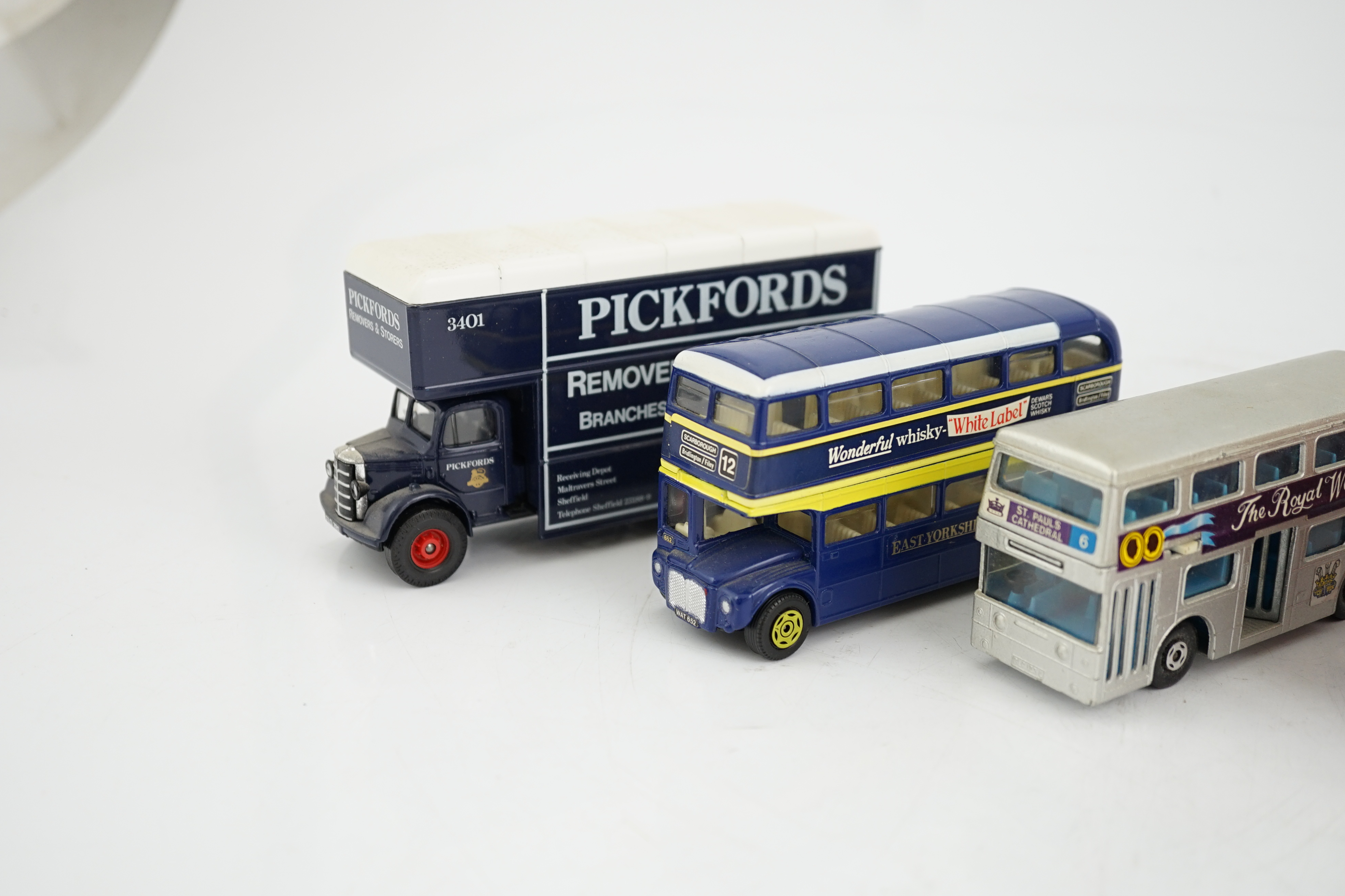 Thirty-six boxed diecast vehicles by Vanguard, Atlas Dinky, Revell, etc. including; cars, commercial vehicles, police cars, TV related cars, an Action 1:32 scale UPS van, four Jet Age military aircraft, etc. together wit